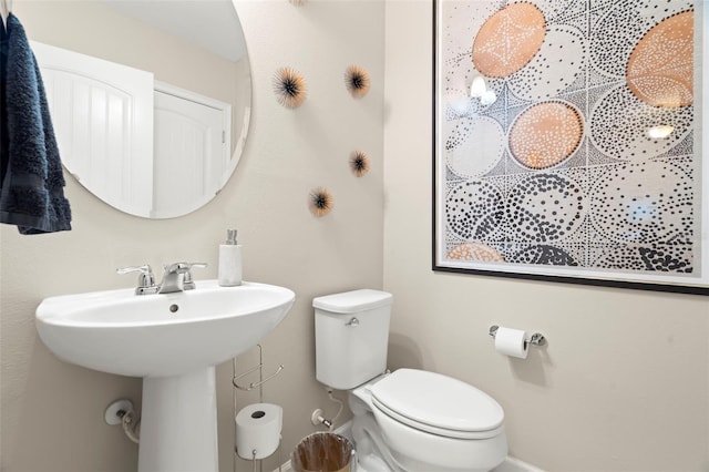 bathroom with toilet and sink