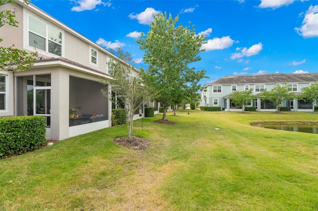 view of yard featuring a sunroom