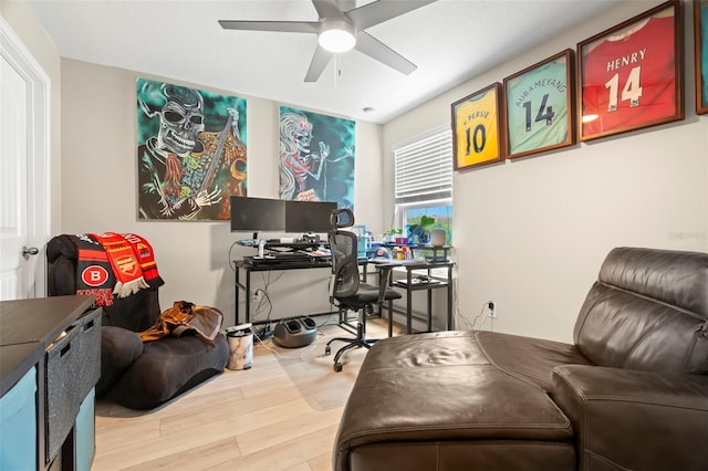 office with wood-type flooring and ceiling fan