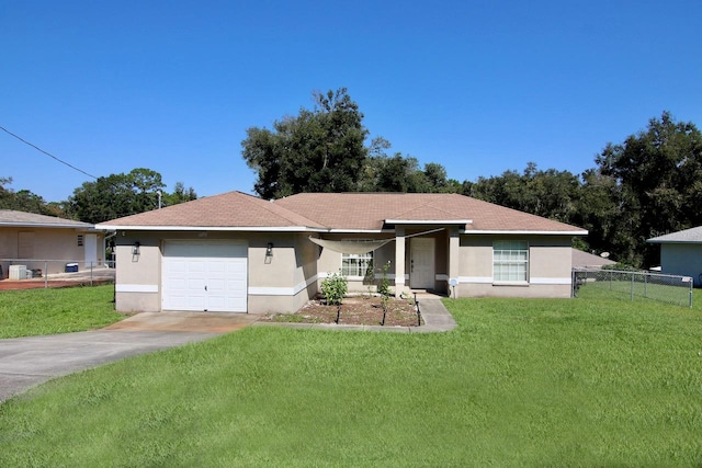 ranch-style home with a garage and a front yard