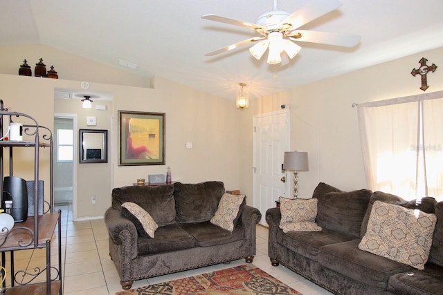 living room with light tile patterned flooring, vaulted ceiling, and ceiling fan