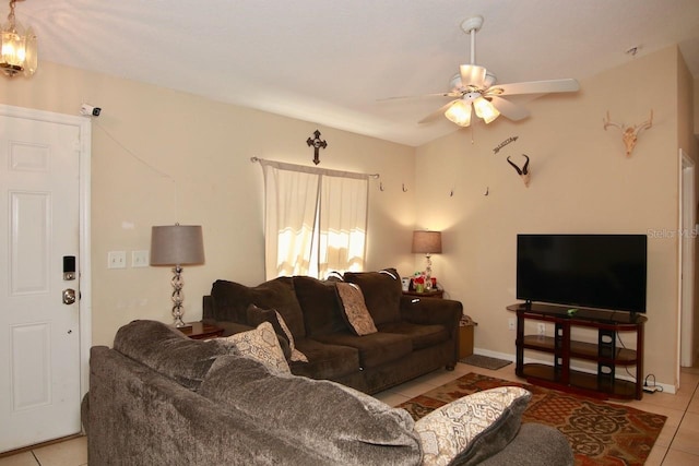 tiled living room with ceiling fan