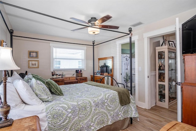 bedroom with ceiling fan and light wood-type flooring