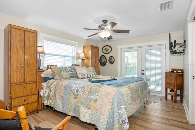 bedroom with french doors, access to outside, light hardwood / wood-style flooring, and ceiling fan