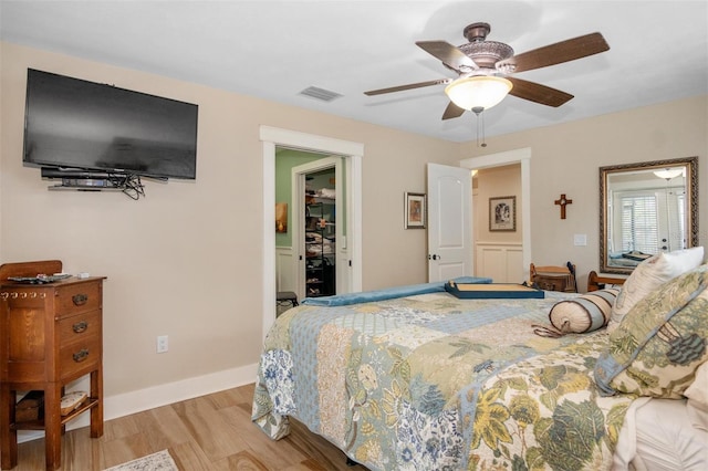 bedroom featuring light hardwood / wood-style floors and ceiling fan