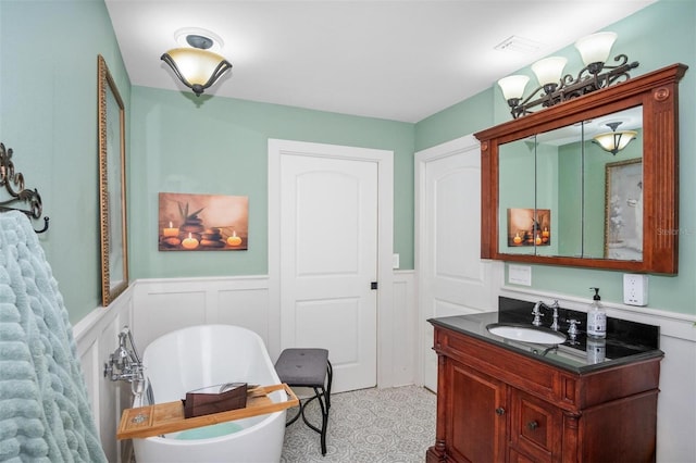 bathroom with vanity and a bathtub