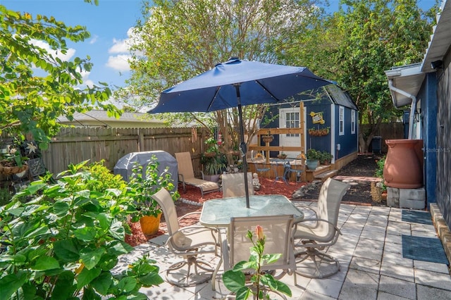 view of patio with an outdoor structure