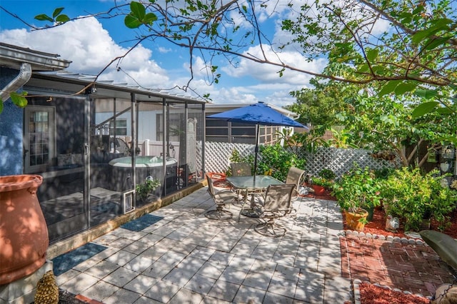 view of patio featuring a sunroom