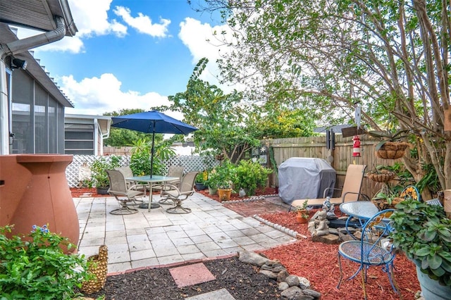 view of patio featuring a grill