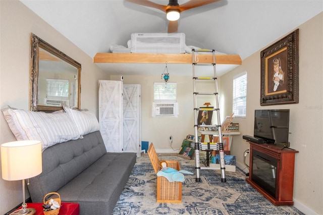 living room featuring cooling unit, ceiling fan, and lofted ceiling