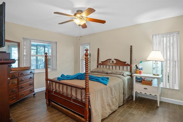 bedroom with wood finished floors, a ceiling fan, and baseboards