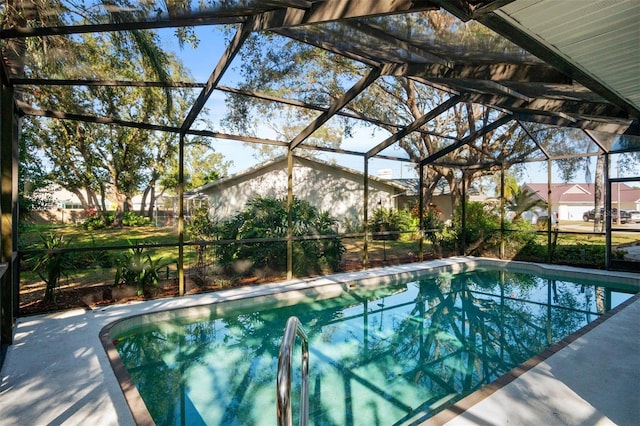 pool with a lanai and a patio