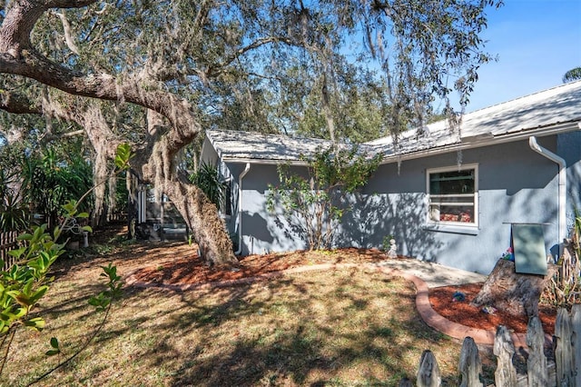 view of property exterior with stucco siding