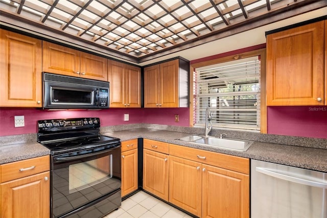 kitchen featuring sink, black appliances, and light tile patterned floors