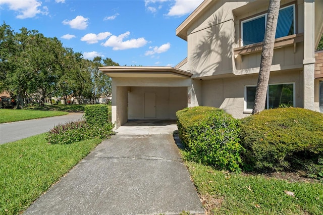 doorway to property with a carport