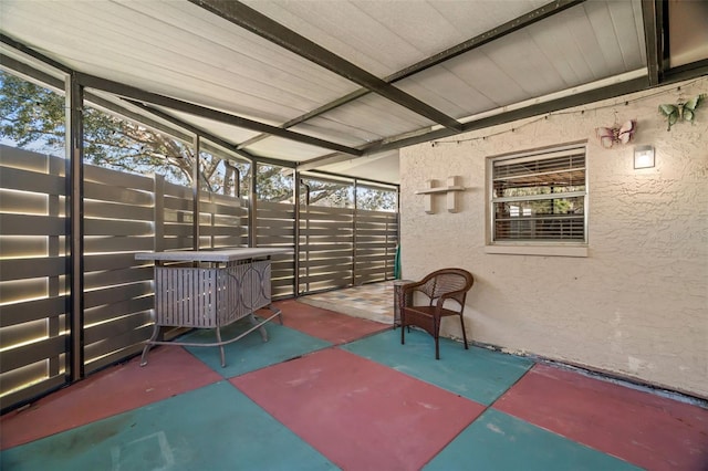 unfurnished sunroom with vaulted ceiling