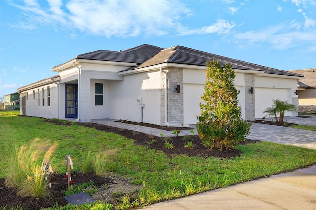 view of property exterior with a lawn and a garage