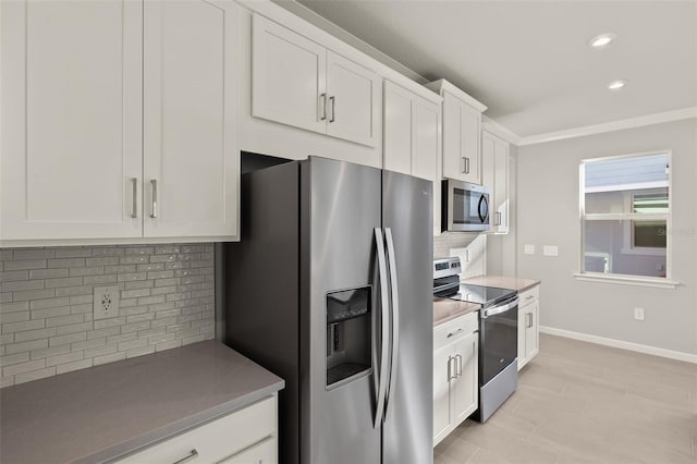 kitchen featuring backsplash, white cabinetry, and stainless steel appliances