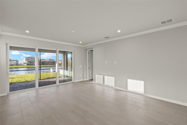 spare room with a water view and ornamental molding