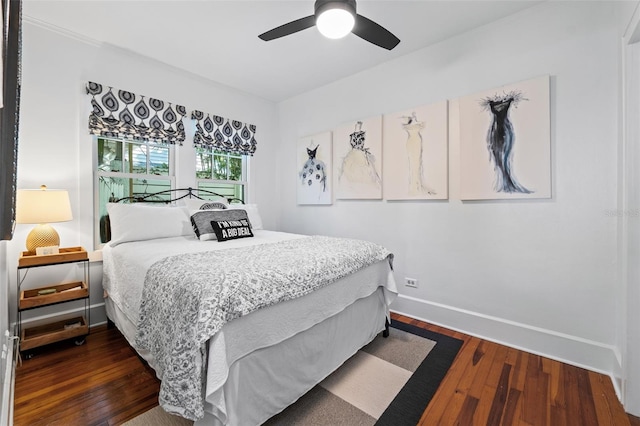 bedroom featuring dark wood-type flooring and ceiling fan