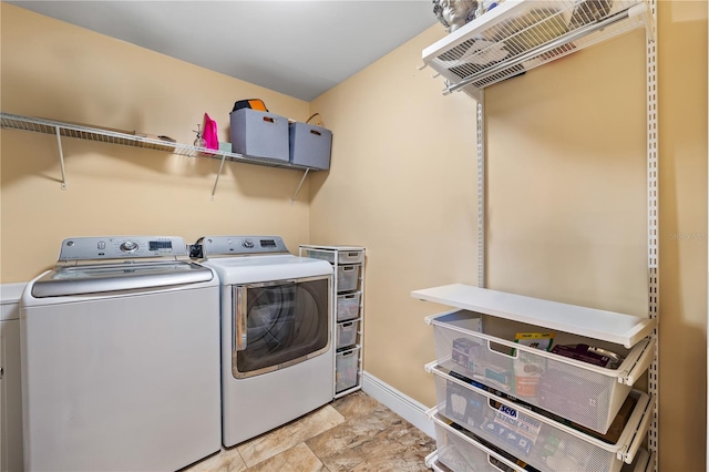 washroom featuring washing machine and clothes dryer