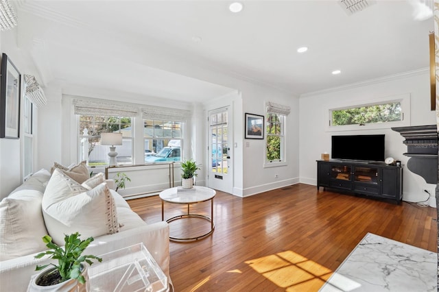 living room with crown molding and dark hardwood / wood-style floors