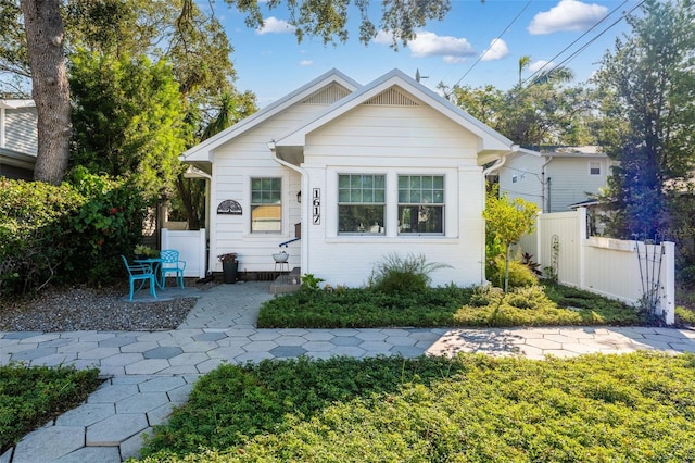 bungalow-style house with a patio area