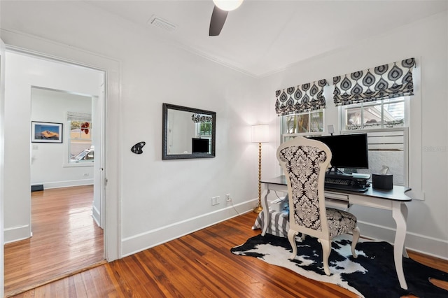 home office with crown molding, hardwood / wood-style flooring, and ceiling fan