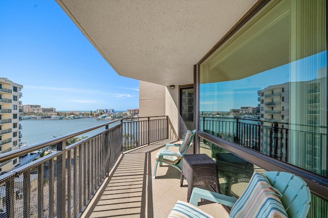 balcony featuring a water view