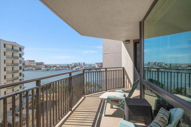 balcony featuring a water view