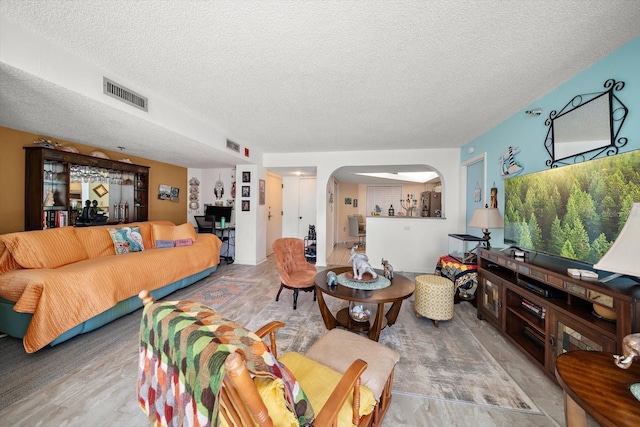 living room featuring a textured ceiling