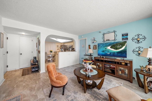 living room with a textured ceiling