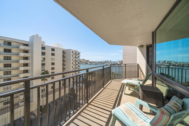 balcony featuring a water view