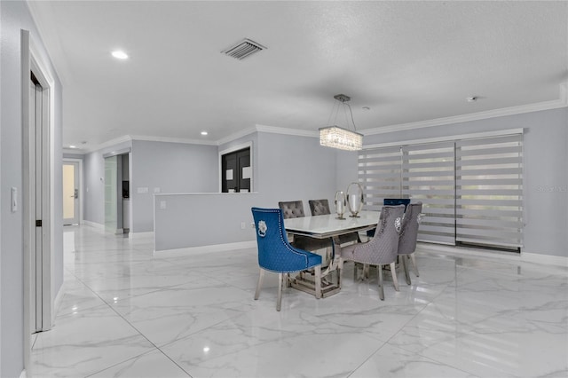 dining area with a textured ceiling and ornamental molding