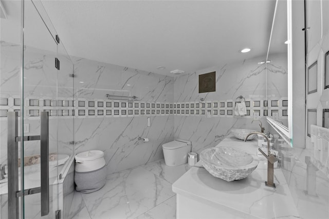 bathroom with vanity, toilet, an enclosed shower, and tile walls