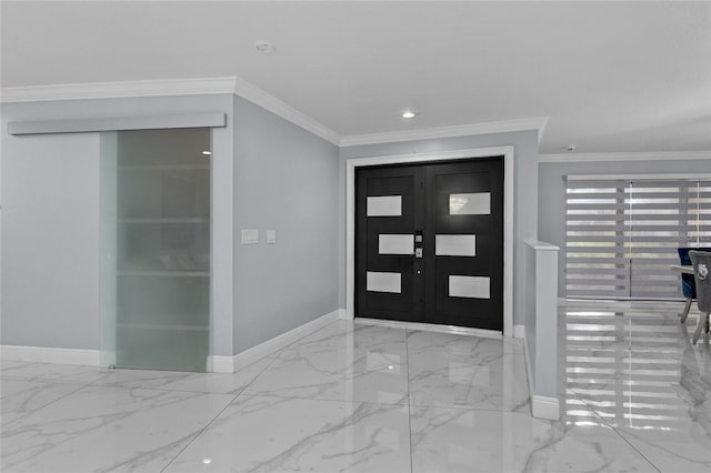 foyer featuring crown molding and french doors