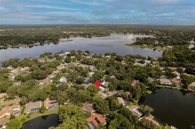 birds eye view of property with a water view