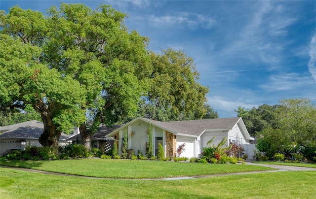 single story home with a front lawn and a garage