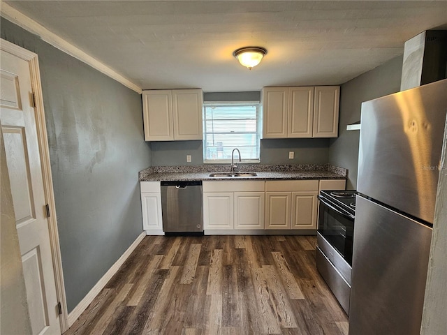 kitchen with stainless steel appliances, sink, and dark hardwood / wood-style floors