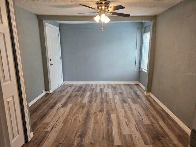 spare room featuring hardwood / wood-style floors, a textured ceiling, and ceiling fan