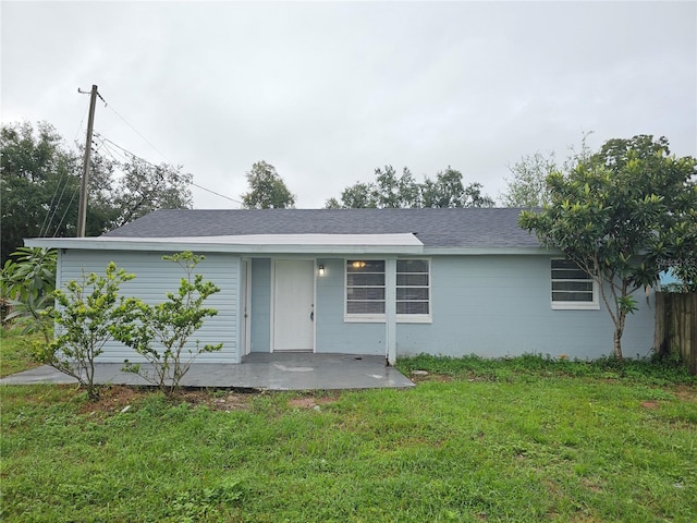 single story home featuring a patio area and a front lawn