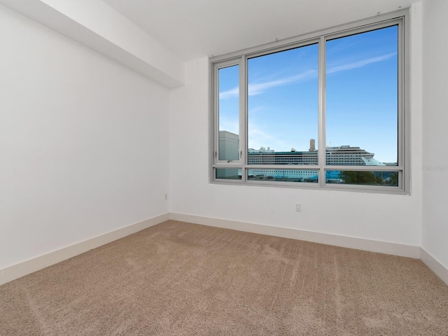 unfurnished room with carpet floors