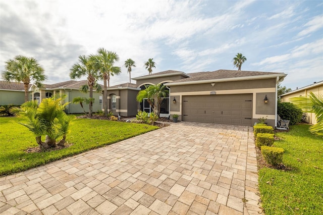 ranch-style house featuring a front yard and a garage