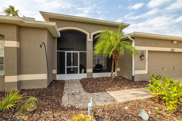 entrance to property featuring a garage