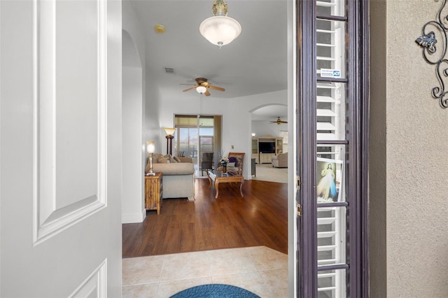 entrance foyer with hardwood / wood-style floors and ceiling fan