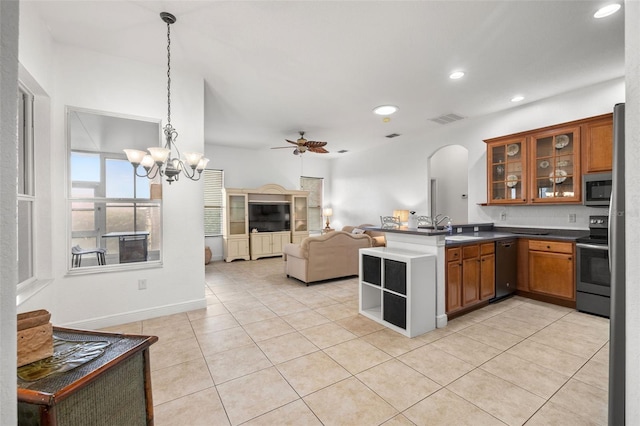 kitchen featuring light tile patterned flooring, ceiling fan with notable chandelier, kitchen peninsula, stainless steel appliances, and decorative light fixtures