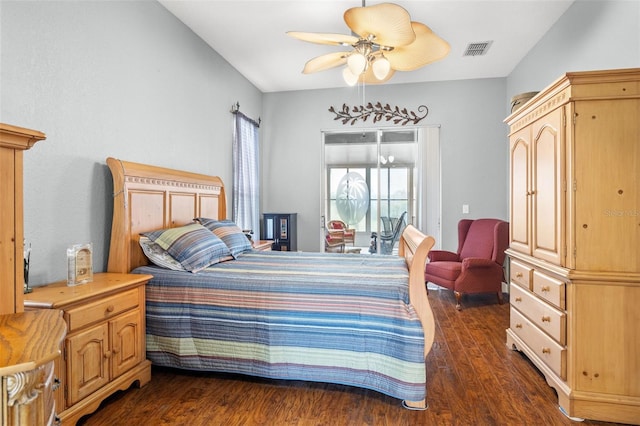 bedroom with ceiling fan and dark hardwood / wood-style floors