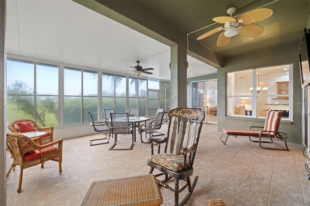 sunroom with ceiling fan