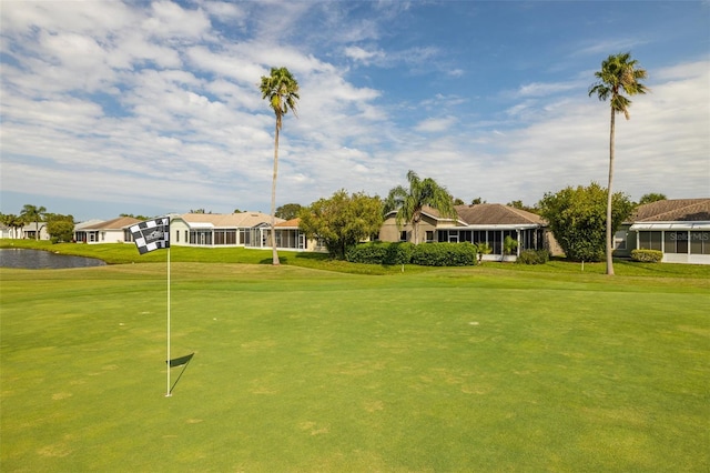 surrounding community featuring a yard and a water view