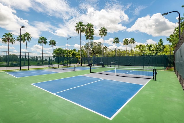 view of tennis court featuring basketball court